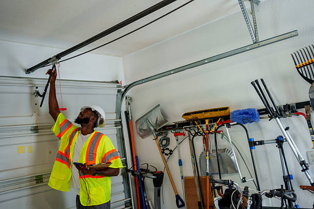 Professional Garage Door Panel Replacement technician working in Roland, AR